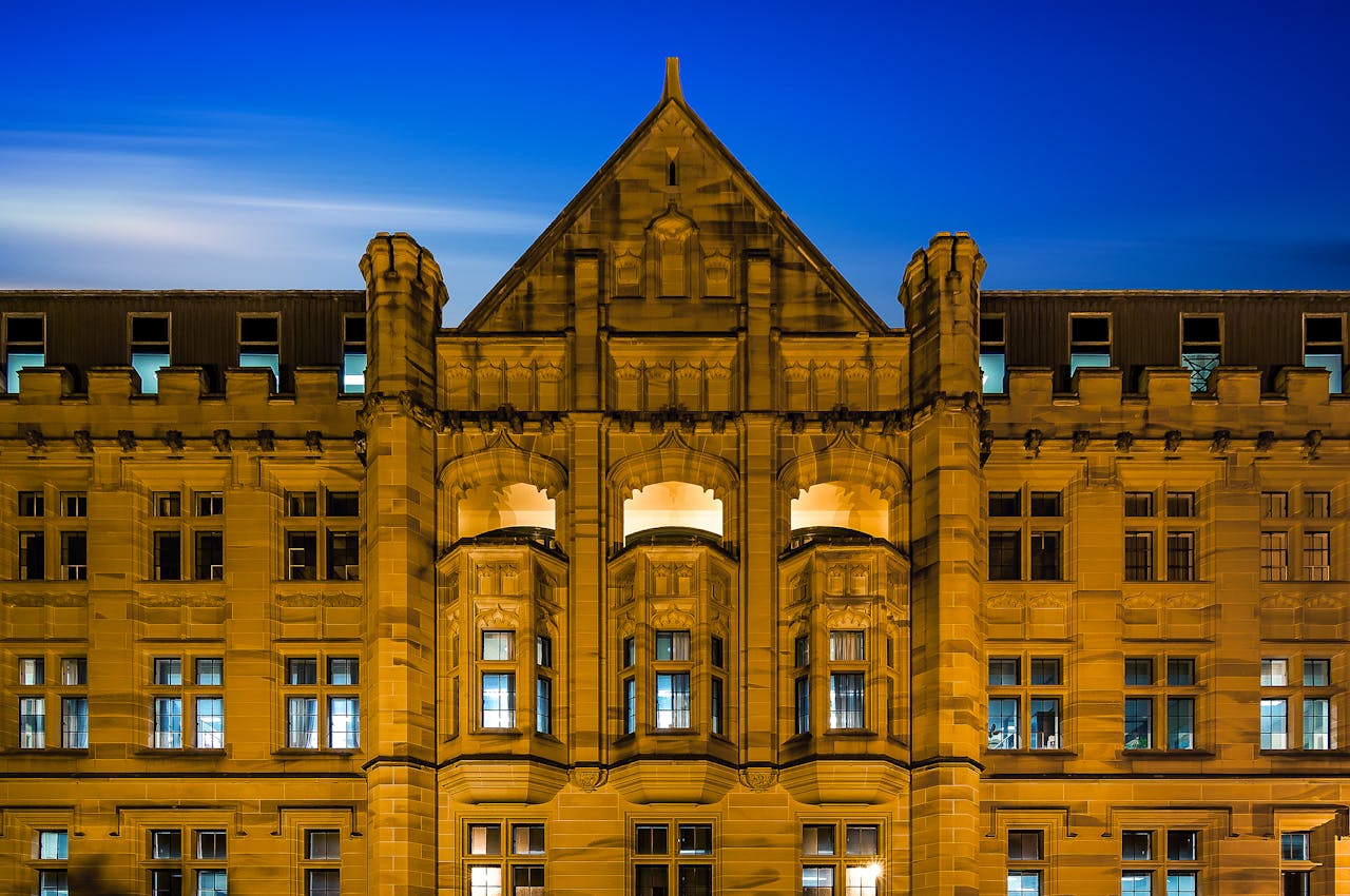 Stunning facade of a historic Gothic-style building in Sydney at night.
